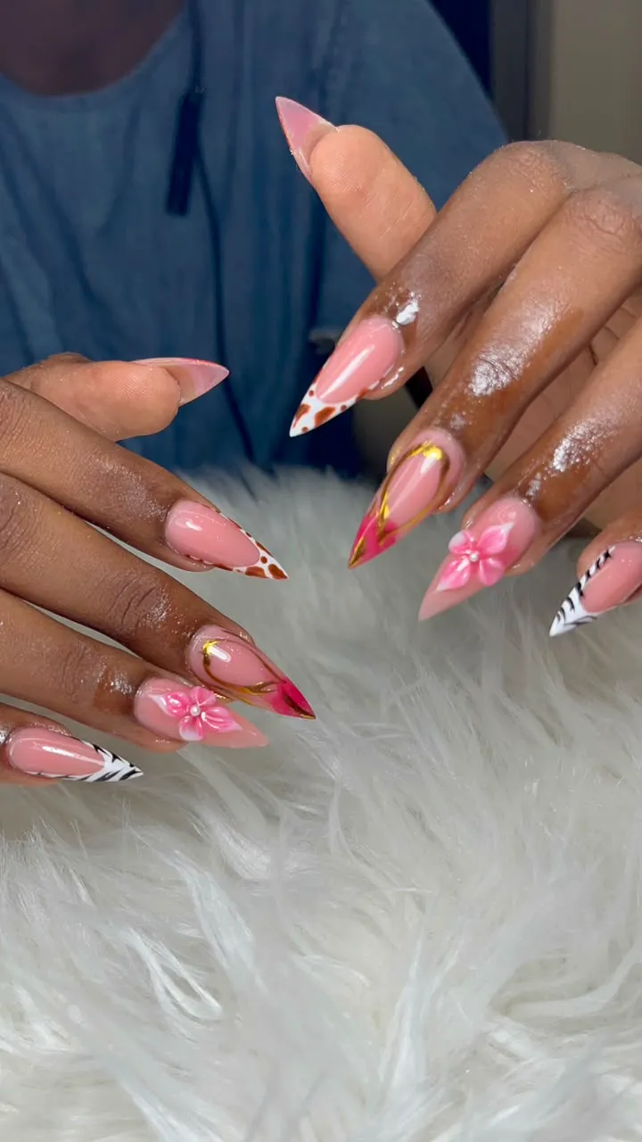 Pink nails with leopard, zebra and flower designs