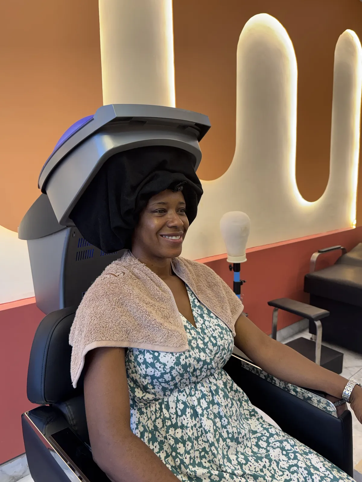 Hair treatment under a steam hood